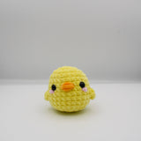 amigurumi crochet charli the chick plushie made with chenille yarn