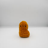amigurumi crochet nugget plushie made with golden chenille yarn