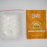 beginner crochet kit charli the chick pamphlet with written and video tutorials, and stuffing.
