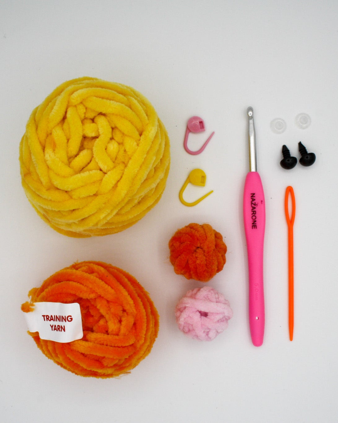 beginner crochet kit charli the chick materials including training yarn, chenille yarn for chick, stitch markers, darning needle, safety eyes and crochet hook.