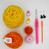 beginner crochet kit charli the chick materials including training yarn, chenille yarn for chick, stitch markers, darning needle, safety eyes and crochet hook.