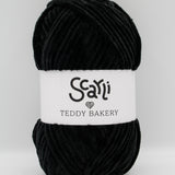 Teddy Bakery chenille yarn in shade onyx pitch black. Soft chunky plush yarn