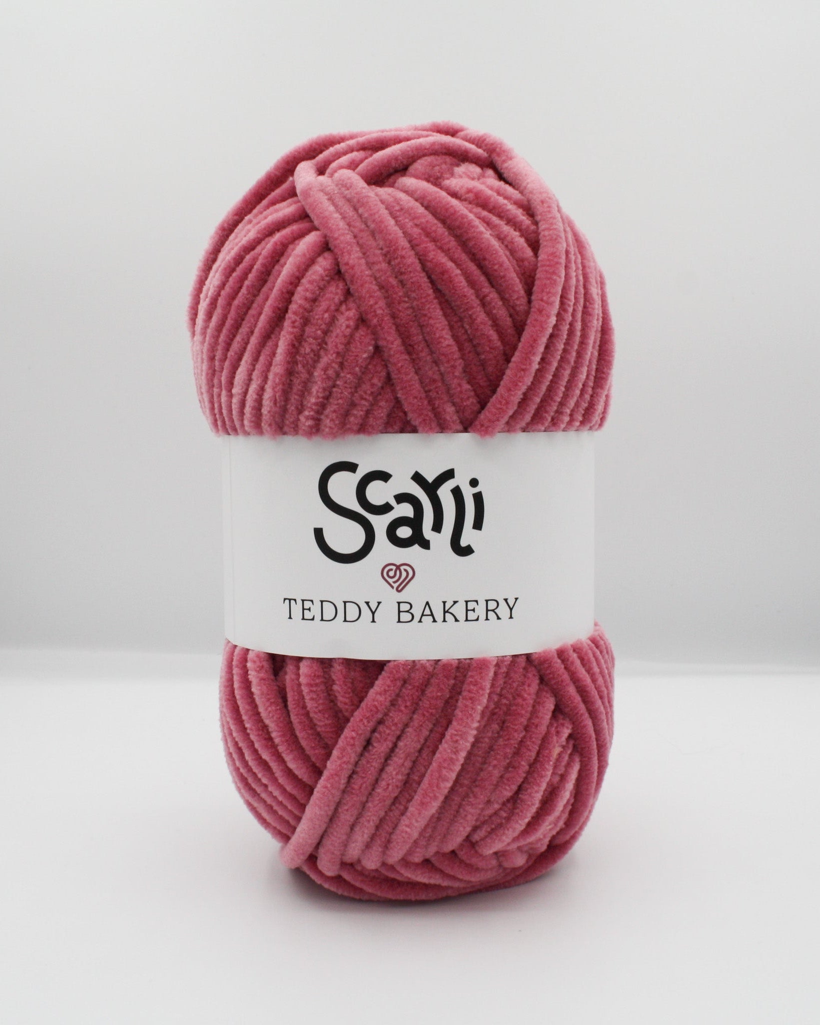 skein of rose pink chenille plush yarn teddy bakery scarli