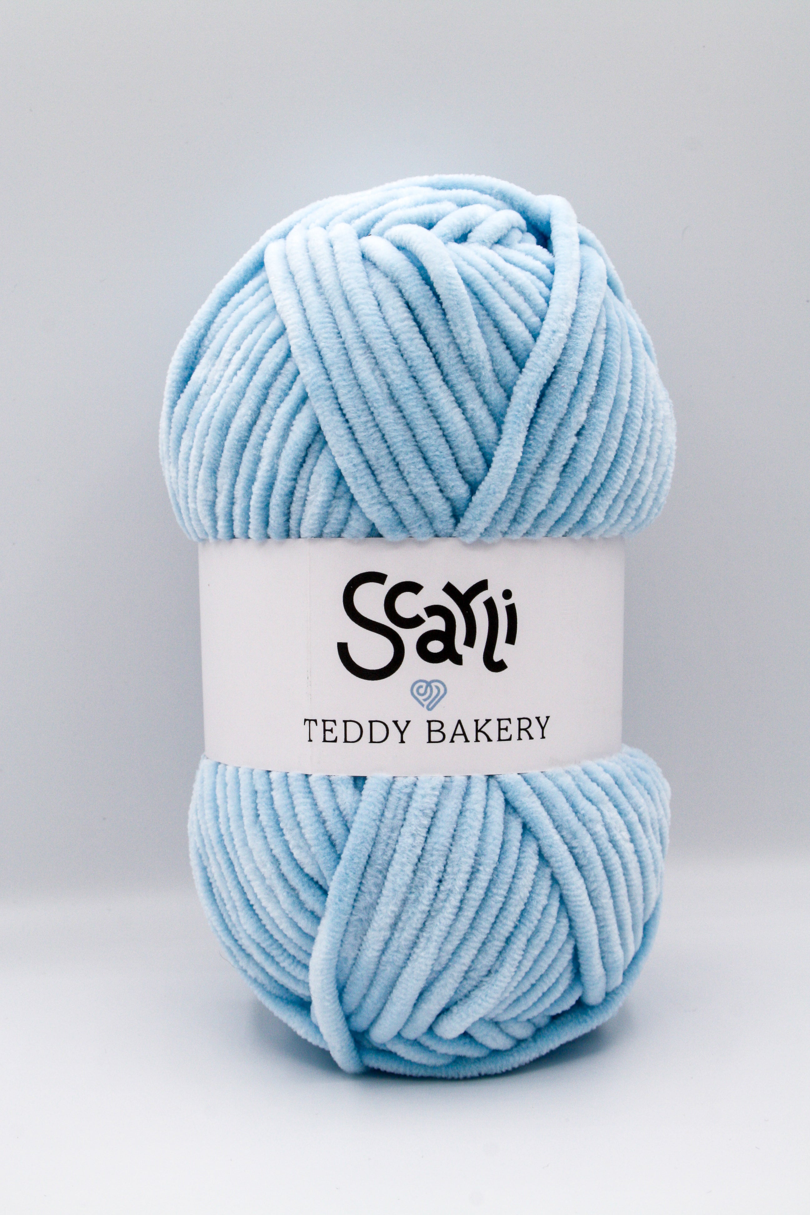 Teddy Bakery chenille yarn in shade baby blue light blue. Soft chunky plush yarn