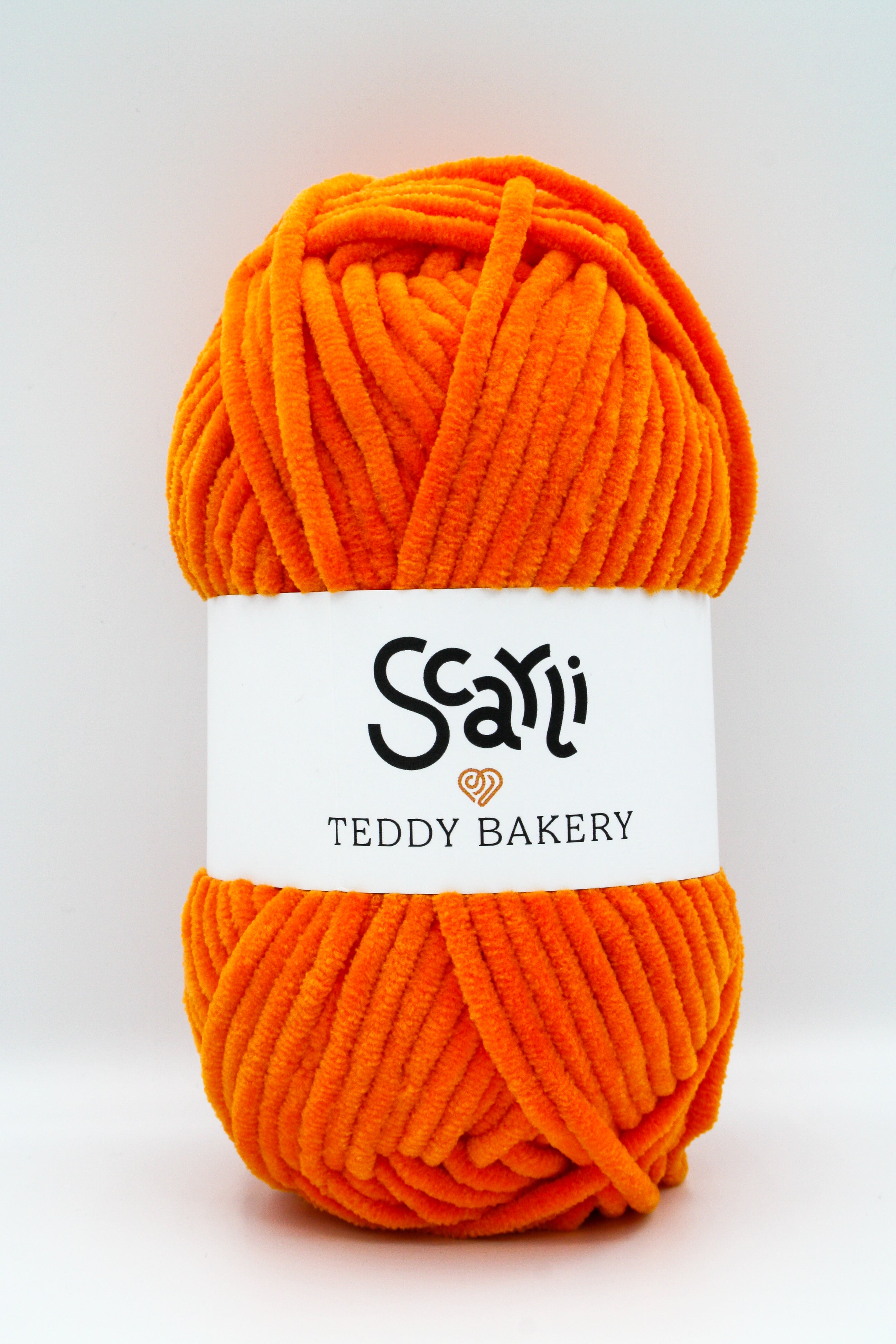 Teddy Bakery chenille yarn in shade mango orange. Soft chunky plush yarn