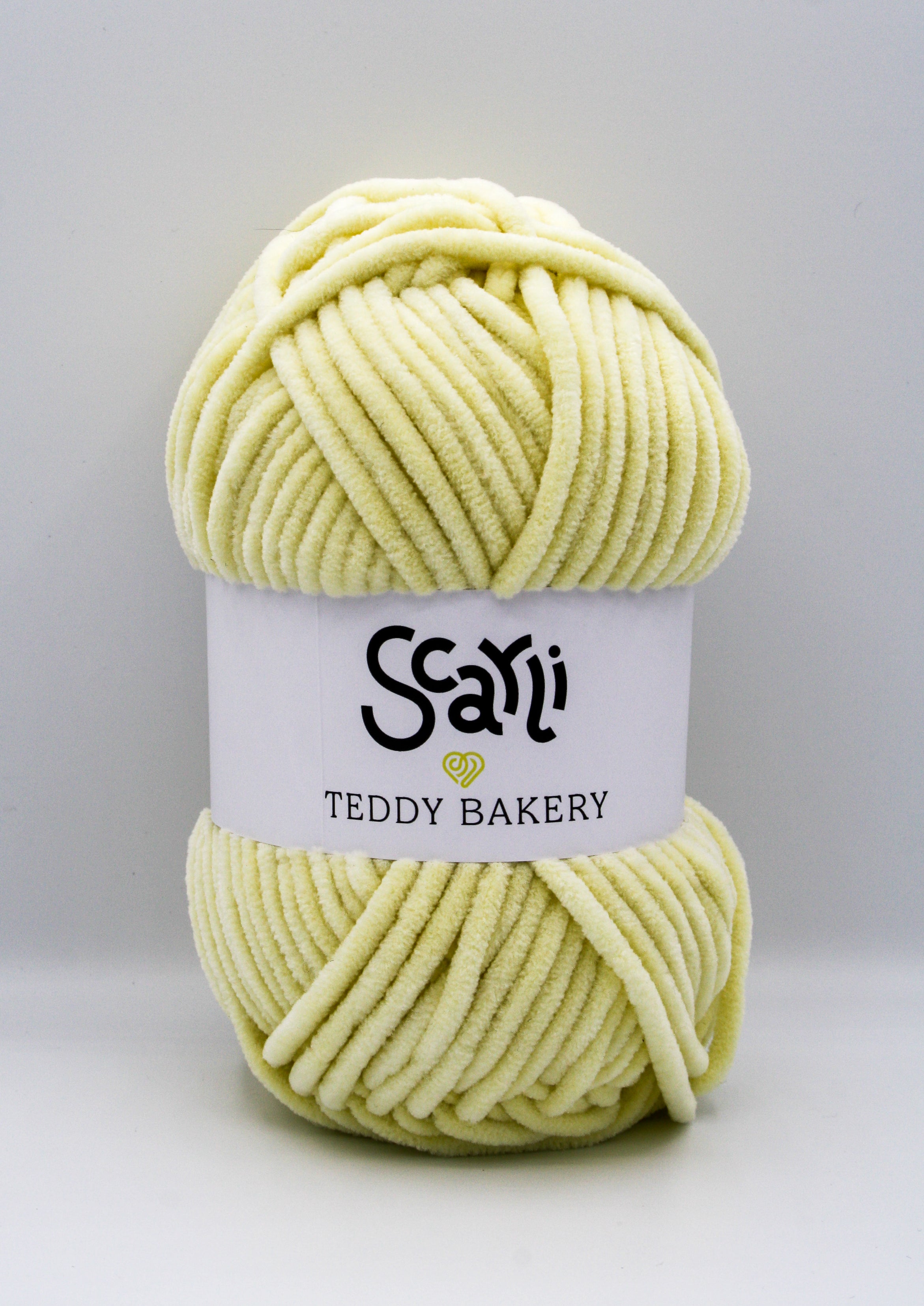 Teddy Bakery chenille yarn in shade banana pale pastel yellow. Soft chunky plush yarn