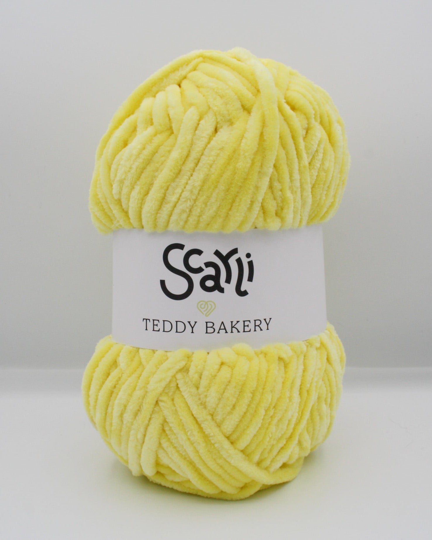 skein of yellow chenille plush yarn teddy bakery scarli daffodil