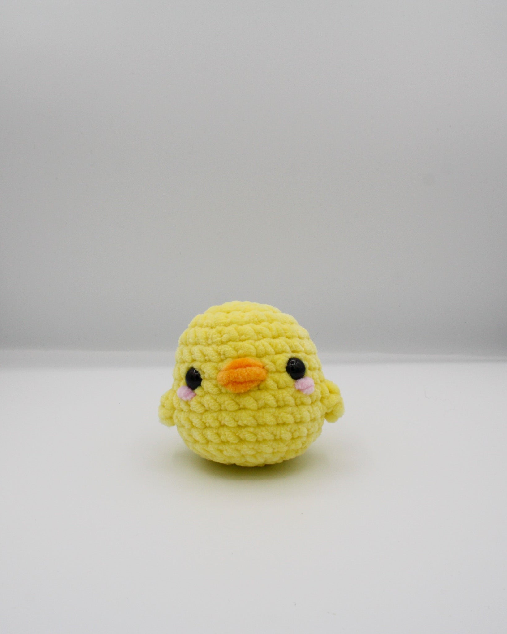 amigurumi crochet charli the chick plushie made with chenille yarn