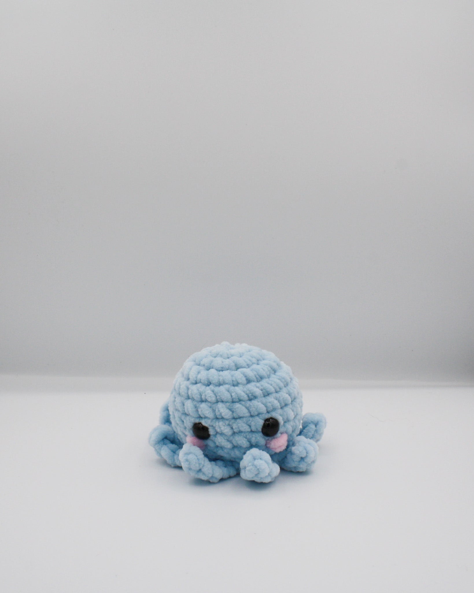 amigurumi crochet Ozzy the octopus plushie made with chenille yarn
