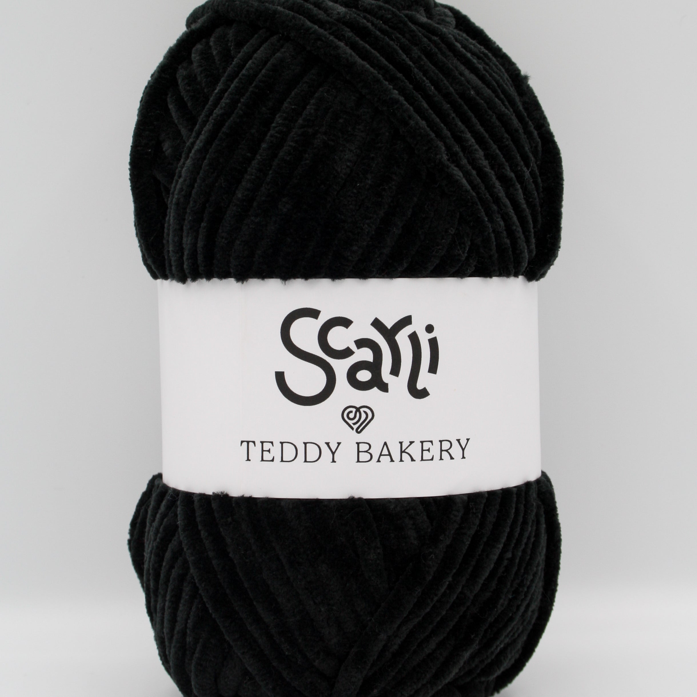 Teddy Bakery chenille yarn in shade onyx pitch black. Soft chunky plush yarn