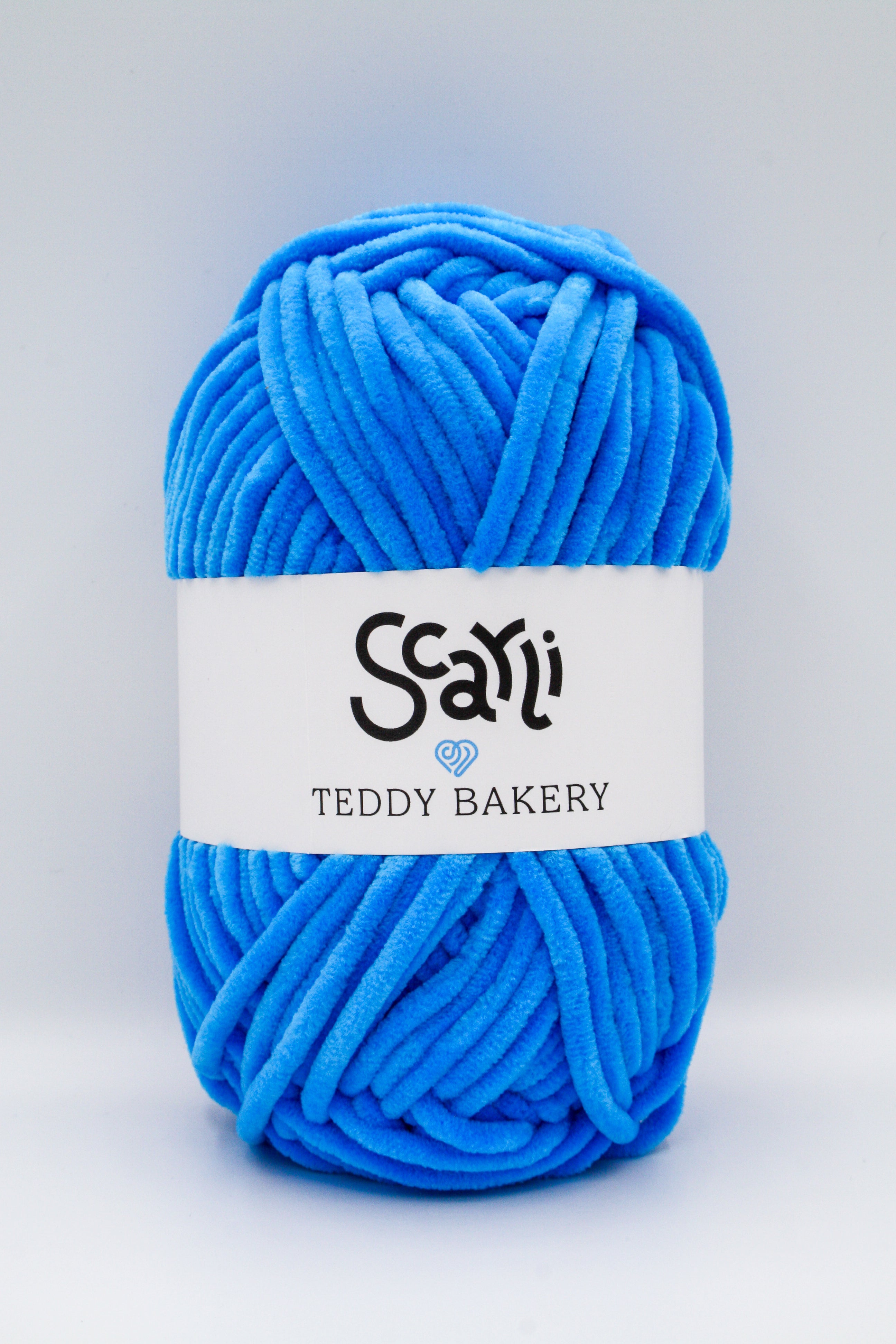 Teddy Bakery chenille yarn in shade sapphire bright blue. Soft chunky plush yarn