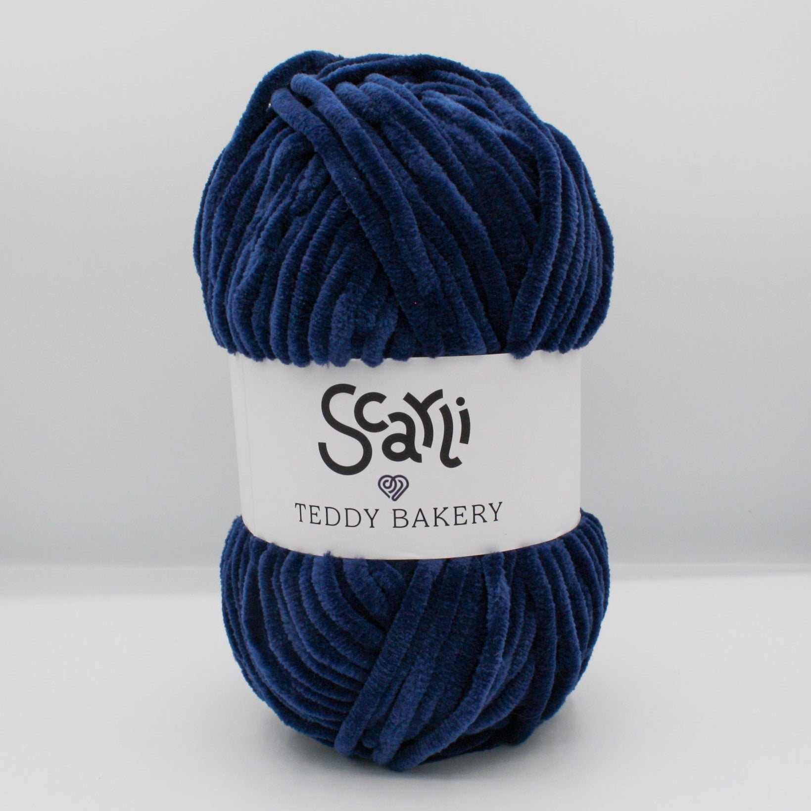 navy blue skein of chenille plush yarn teddy bakery scarli