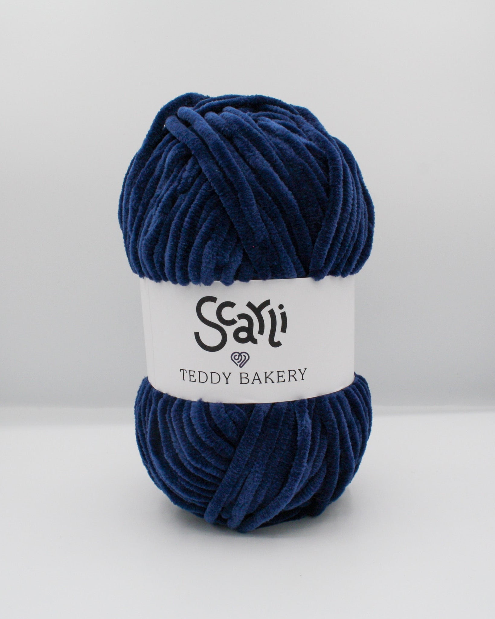 navy blue skein of chenille plush yarn teddy bakery scarli