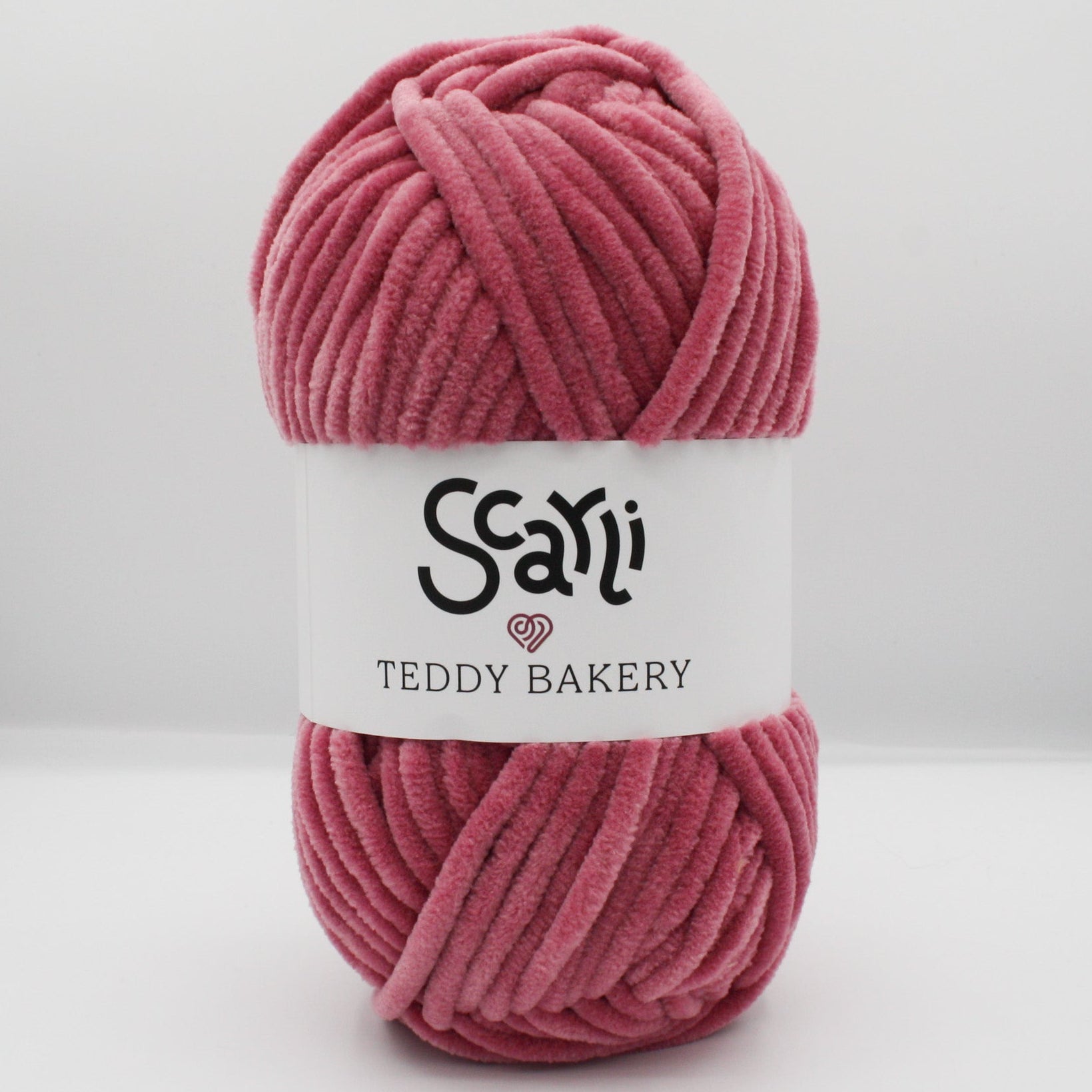 skein of rose pink chenille plush yarn teddy bakery scarli
