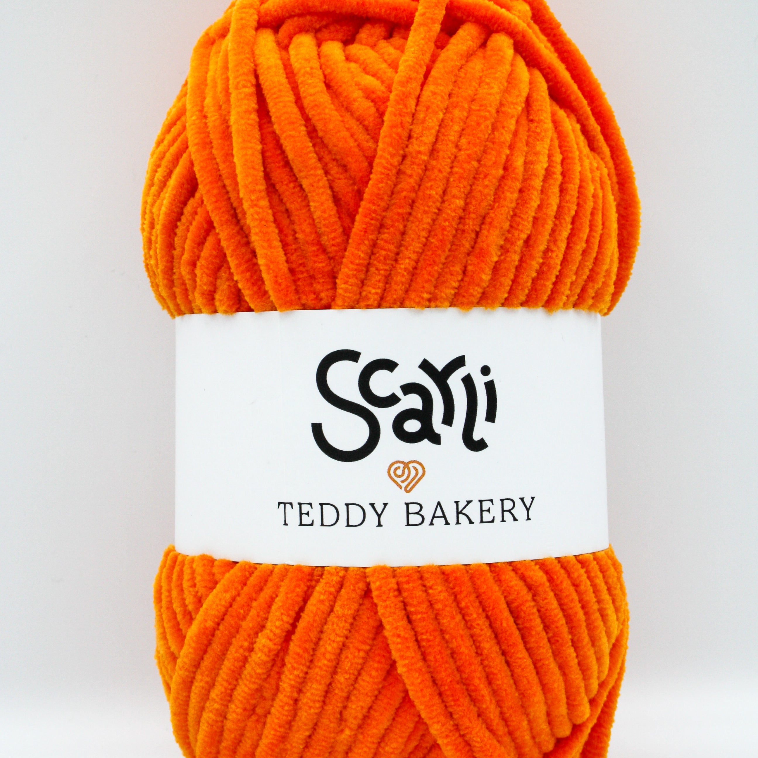 Teddy Bakery chenille yarn in shade mango orange. Soft chunky plush yarn