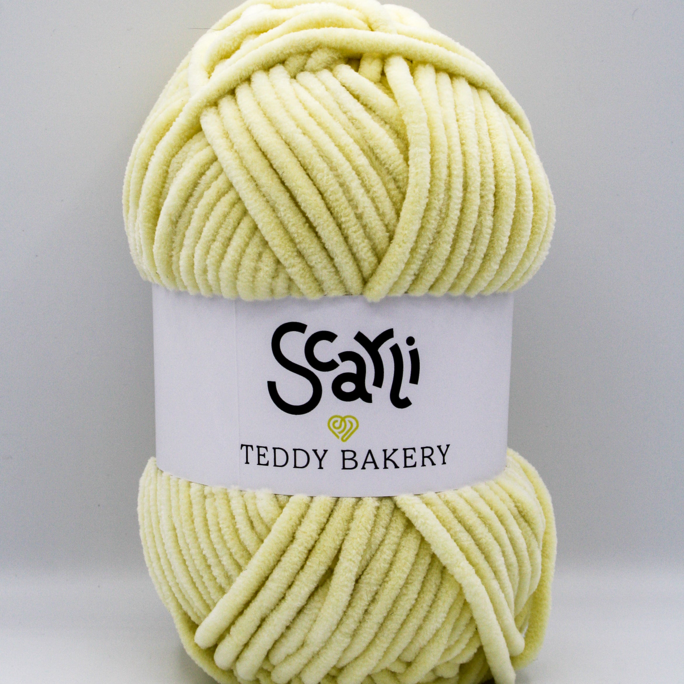 Teddy Bakery chenille yarn in shade banana pale pastel yellow. Soft chunky plush yarn