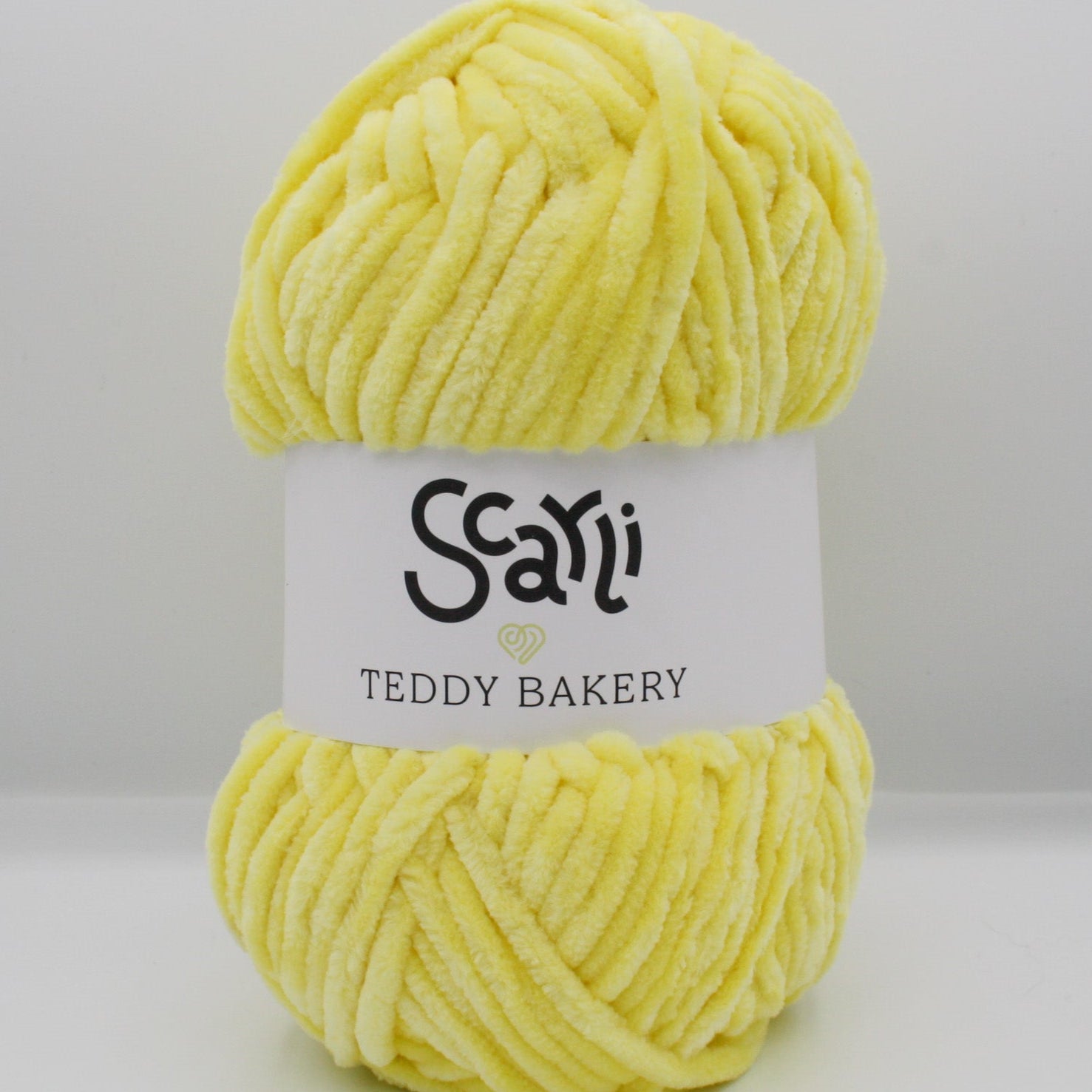 skein of yellow chenille plush yarn teddy bakery scarli daffodil