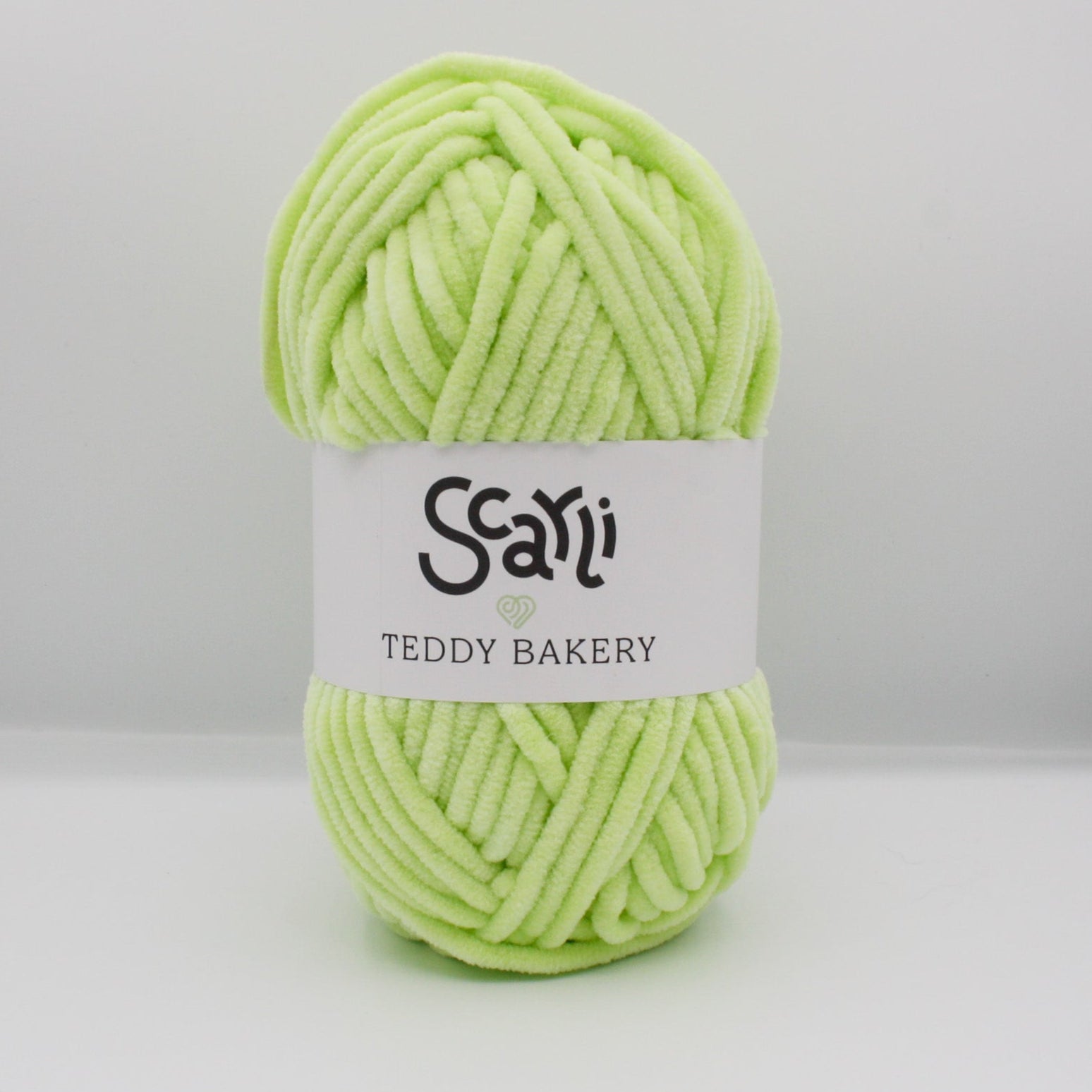 skein of lime green chenille plush yarn scarli teddy bakery